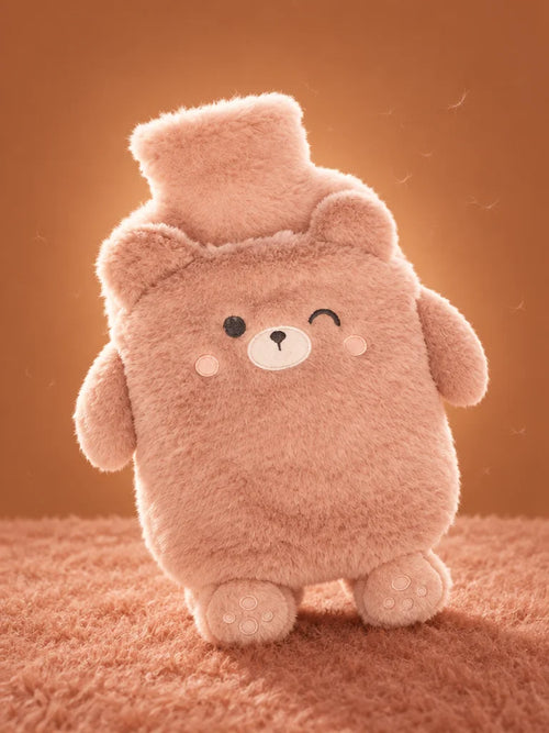 A portrait studio photograph of one complete rose-colored bear-shaped Ondine hot-water bottle, match